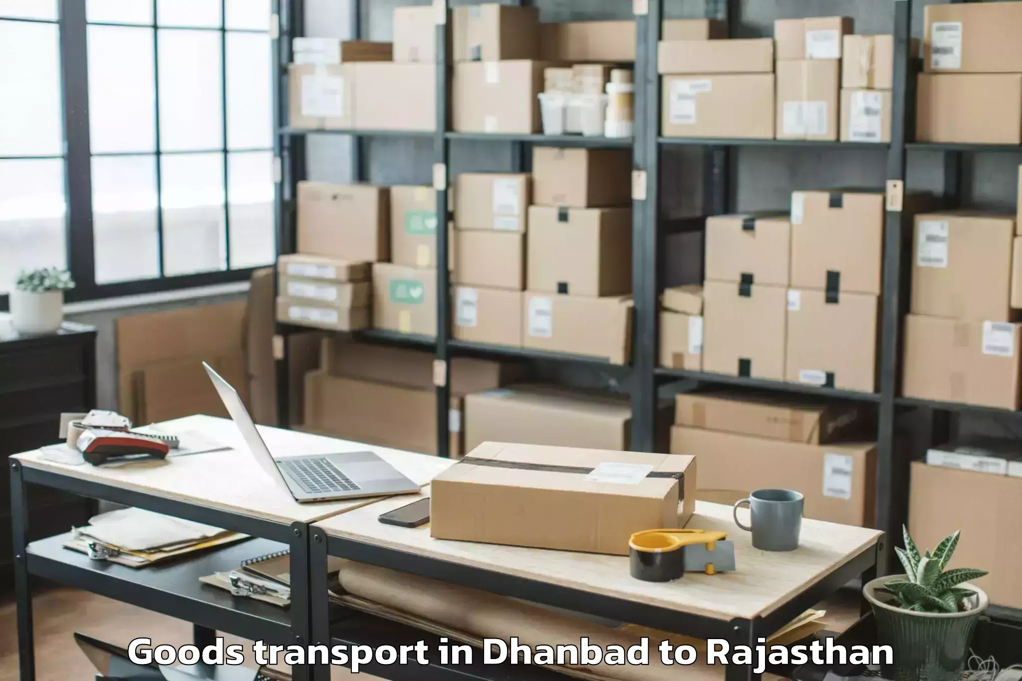 Easy Dhanbad to Sunrise University Alwar Goods Transport Booking